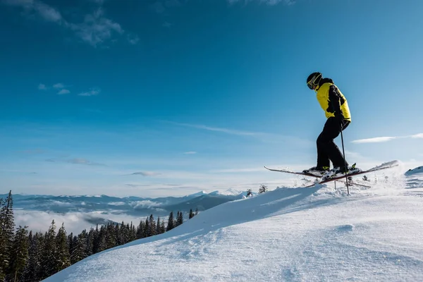 Side View Skier Holding Ski Sticks While Jumping Blue Sky — Stock Photo, Image