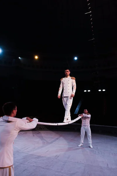 Acrobats Supporting Handsome Man Walking Metallic Pole Circus — 스톡 사진