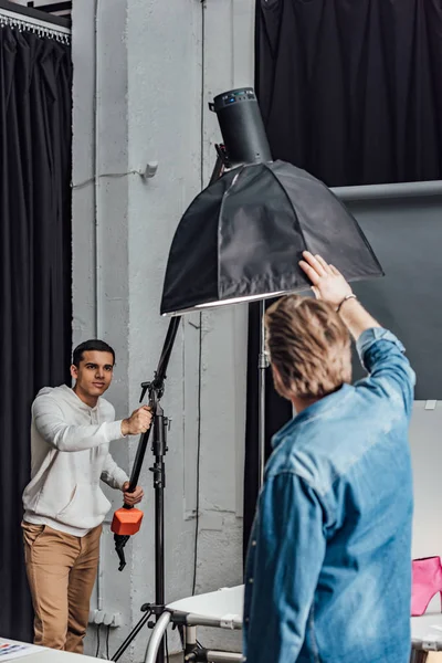 Handsome Assistant Holding Reflector Art Director Photo Studio — ストック写真