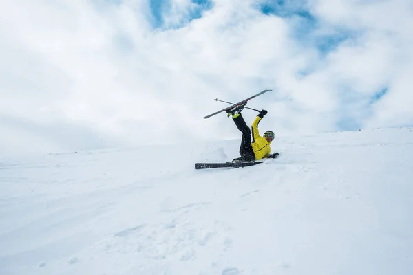 Sportsman falling while skiing on slope — Stock Photo, Image