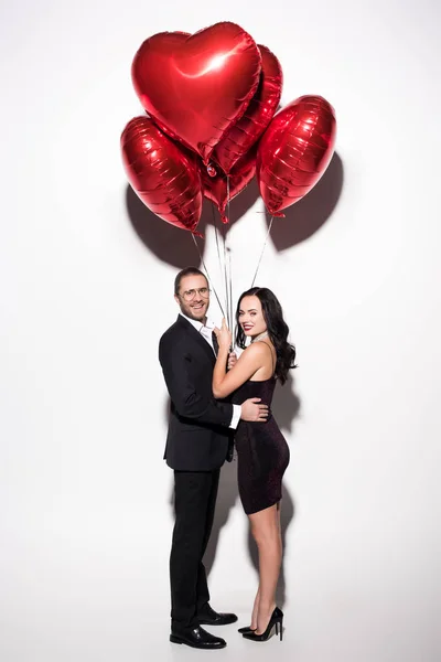Smiling Couple Holding Red Heart Shaped Balloons Valentines Day White — 스톡 사진