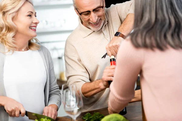 Selective Focus Man Opening Bottle Wine Woman Cutting Lettuce — Stock Photo, Image