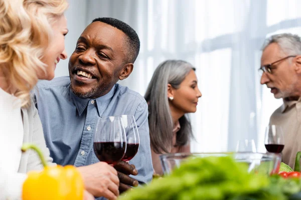 Selective Focus Multicultural Friends Talking Holding Wine Glasses — Stock Photo, Image