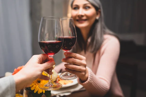 Cropped View Woman Clinking Her Smiling Asian Friend Dinner — Stock Photo, Image