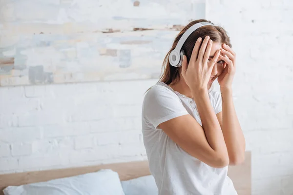 Cheerful Woman Covering Face While Smiling Listening Music Home — Stock Photo, Image