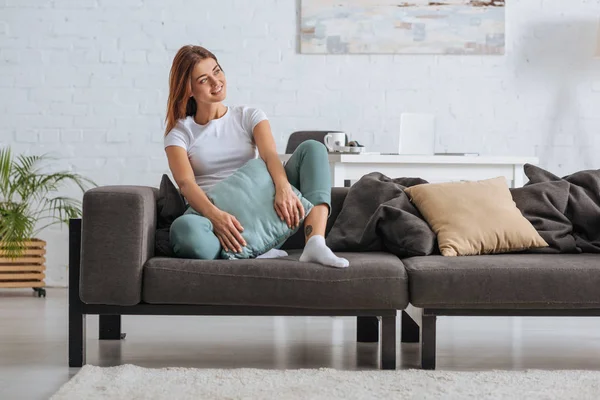 Smiling Girl Looking Away While Relaxing Sofa Pillow — 스톡 사진