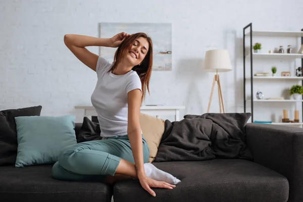 Young Smiling Woman Closed Eyes Chilling Sofa Living Room — Stock Photo, Image