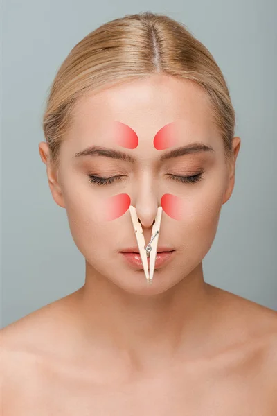 naked young woman with nose inflammation and closed eyes isolated on grey