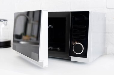close up view of microwave on table in kitchen 