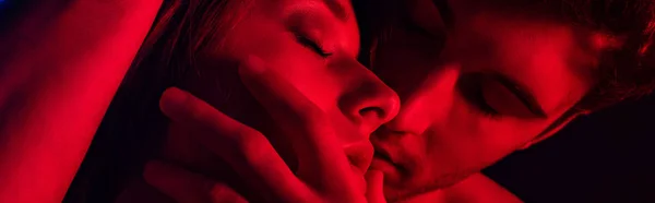 Close View Passionate Young Couple Kissing Red Light Panoramic Shot — Stock Photo, Image