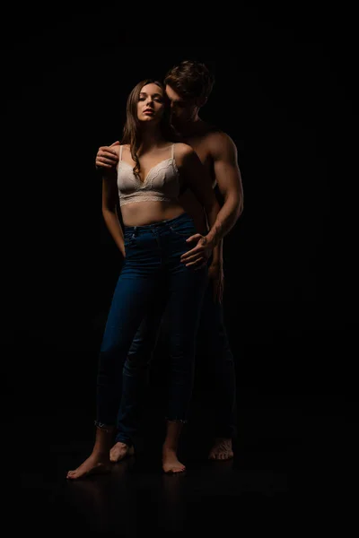 Passionate Undressed Sexy Young Couple Jeans Embracing Isolated Black — Stock Photo, Image