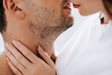 cropped view of woman kissing man at home  clipart