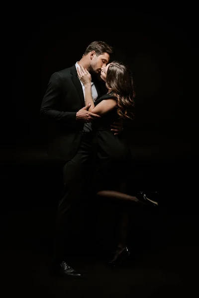 Woman Kissing Handsome Man Suit Isolated Black — Stock Photo, Image