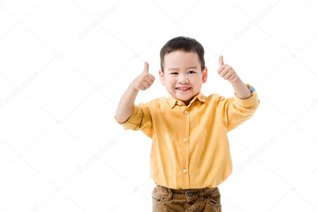 happy little asian boy showing thumbs up isolated on white