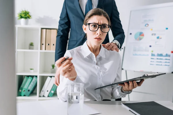 Cropped View Businessman Touching Shocked Businesswoman Office — 图库照片