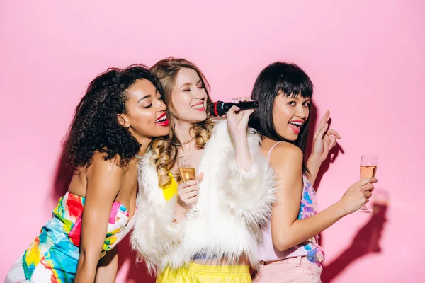 Cheerful Multicultural Girlfriends Holding Champagne Glasses Disco Ball While Singing — Stock Photo, Image