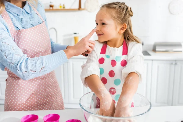 Madre Tocando Nariz Hija Durante Cocina —  Fotos de Stock