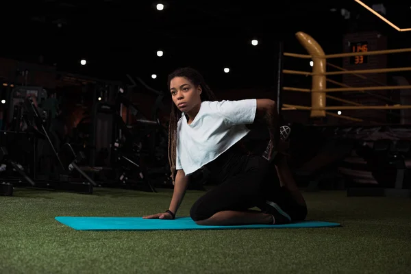 Selective Focus African American Woman Sitting Stretching Fitness Mat — 스톡 사진