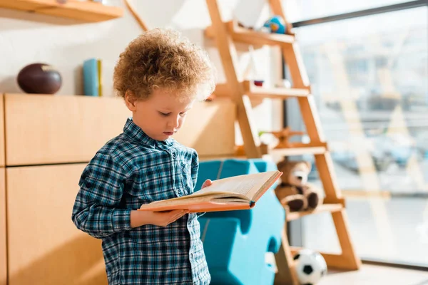 Curly Smart Child Reading Book Home — Stock Photo, Image