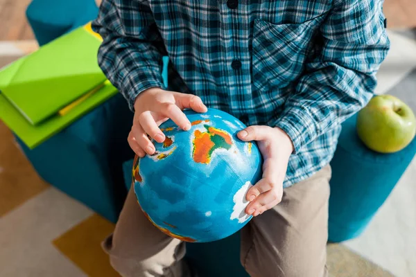 Cropped View Smart Child Holding Globe While Sitting Home — Stock Photo, Image