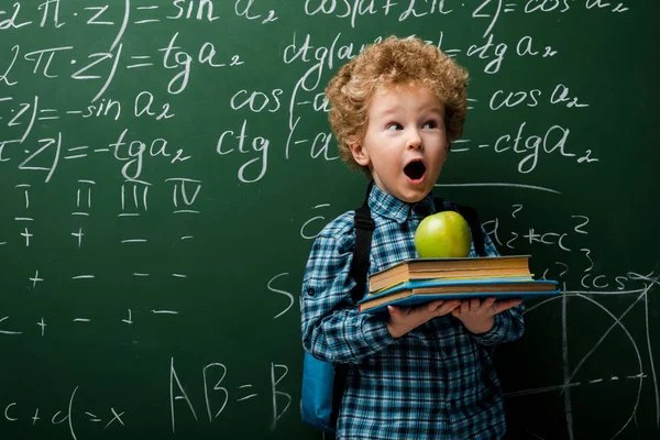 Surprised Kid Holding Books Apple Chalkboard Mathematical Formulas — 스톡 사진