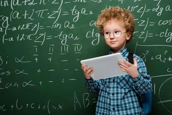 Smart Kid Glasses Holding Digital Tablet Chalkboard Mathematical Formulas — Stock Photo, Image