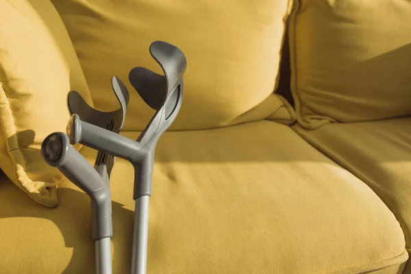 Crutches Yellow Sofa Sunlight — 스톡 사진