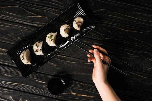 Partial View Woman Eating Delicious Chinese Boiled Dumpling Chopsticks Soy — Stockfoto