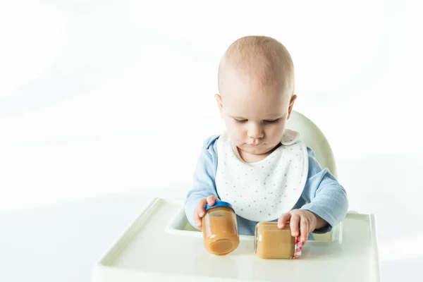 Adorable Baby Boy Holding Jars Baby Food Table Feeding Chair — Stock Photo, Image