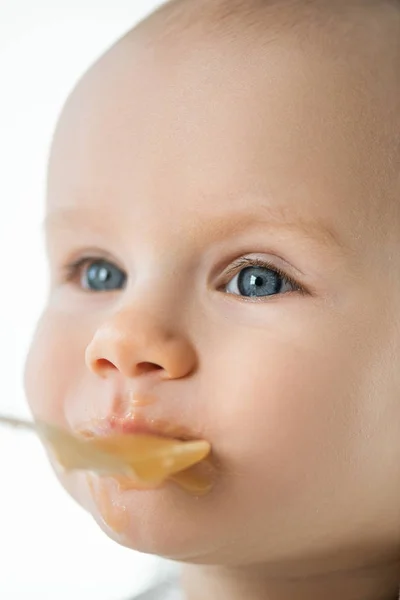 Selective Focus Cute Baby Looking Away Feeding Fruit Puree Isolated — 图库照片