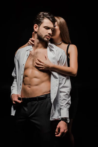 Young Woman Touching Muscular Man Isolated Black — Stock Photo, Image