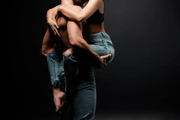 Cropped View Muscular Man Holding Arms Woman Denim Jeans Black — Stock Photo, Image