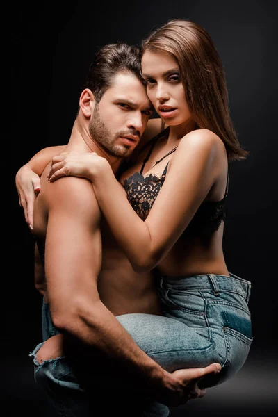 Muscular Man Holding Arms Woman Bra Denim Jeans Black — Stock Photo, Image