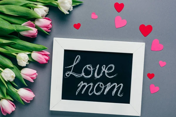 Top View Chalkboard Love Mom Lettering Paper Hearts Tulips Grey — Stock Photo, Image