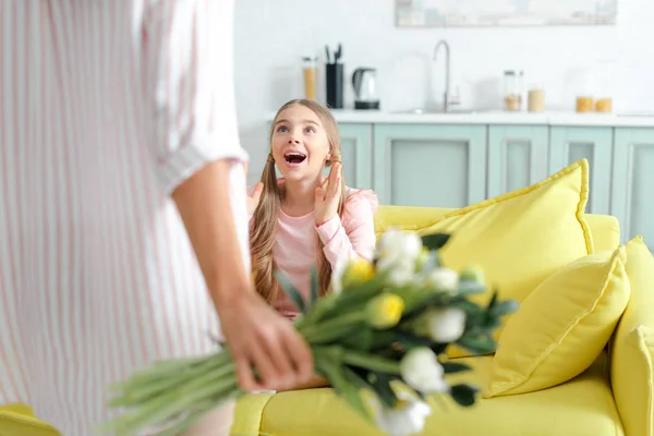 Selective Focus Surprised Kid Looking Mother Flowers — Stok fotoğraf