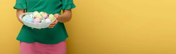 Panoramic Shot Woman Holding Easter Eggs Basket Isolated Yellow — ストック写真