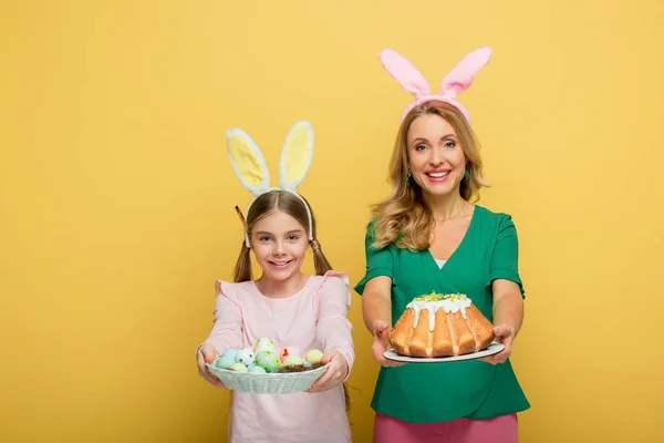 Cheerful Mother Bunny Ears Holding Easter Cake Daughter Painted Chicken — Stock Photo, Image