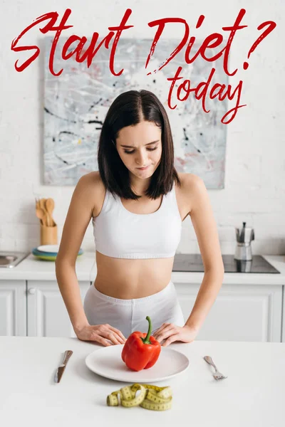 Selective Focus Thoughtful Sportswoman Looking Bell Pepper Measuring Tape Kitchen — Stock Photo, Image