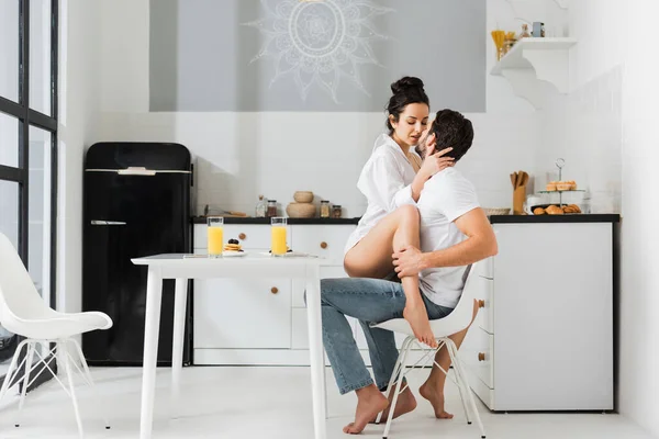 Sensual Woman Kissing Boyfriend Chair Breakfast Kitchen — Stock Photo, Image