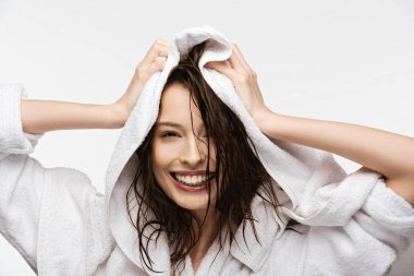 happy girl wiping wet clean hair with white towel isolated on white isolated on white clipart