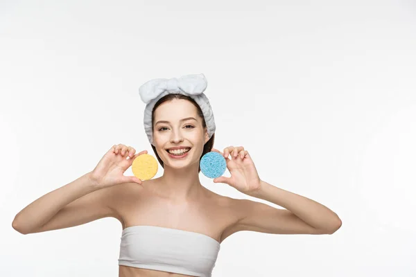 Cheerful Girl Holding Colorful Cosmetic Sponges While Smiling Camera Isolated — Stock Photo, Image