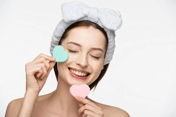 Happy Girl Holding Heart Shaped Cosmetic Sponges Closed Eyes Isolated — Stock Photo, Image