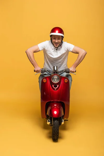 Happy Delivery Man Helmet Riding Scooter Yellow Background — Stock Photo, Image