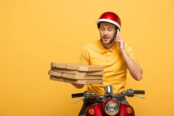 Delivery Man Yellow Uniform Riding Scooter Pizza Boxes Talking Smartphone — Stock Photo, Image