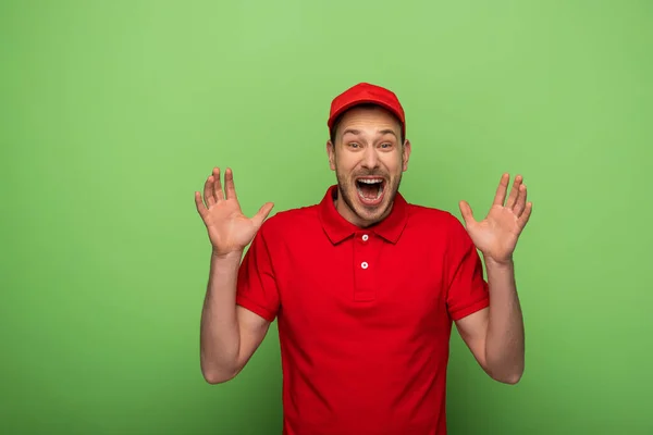 Excited Delivery Man Red Uniform Showing Hands Green — Stock Photo, Image