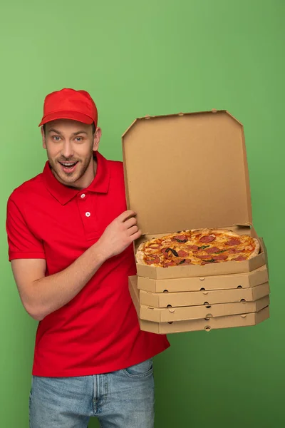 Excited Delivery Man Red Uniform Holding Pizza Boxes Green — Stock Photo, Image