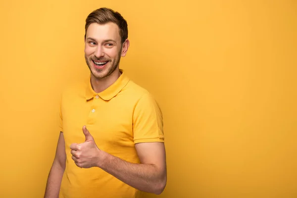 Happy Handsome Man Yellow Outfit Showing Thumb Yellow Background — Stock Photo, Image