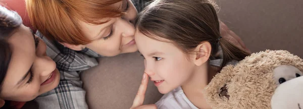 Panoramic Shot Smiling Same Sex Parents Kissing Touching Nose Daughter — Stock Photo, Image