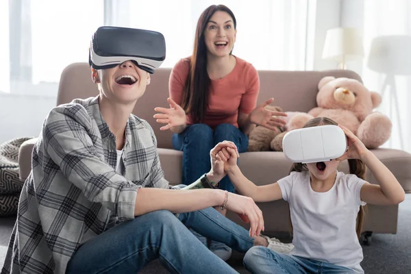 Same Sex Parents Using Virtual Reality Headsets Excited Daughter Living — Stock Photo, Image