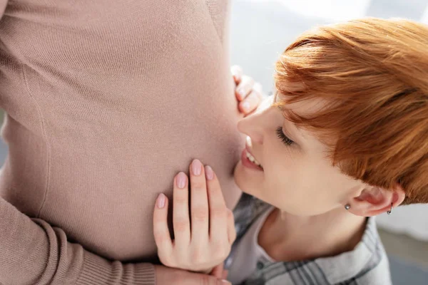 Woman Smiling While Touching Belly Pregnant Girlfriend Home — Stock Photo, Image